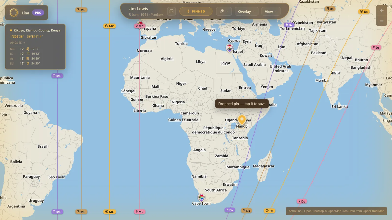 A world map with saved purple pins flying country flags, one active orange pin, and a live coordinates readout showing the relocated angles
